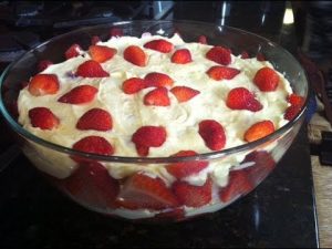 IMG: Strawberries and cream dessert in glass bowl